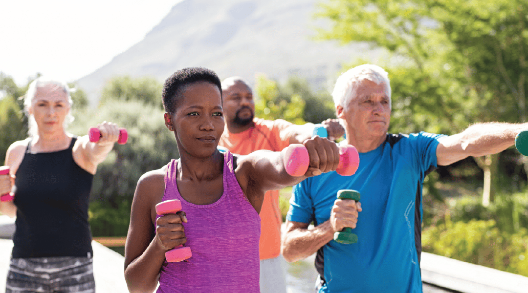 Group of 4 Lifting Weights Outdoors