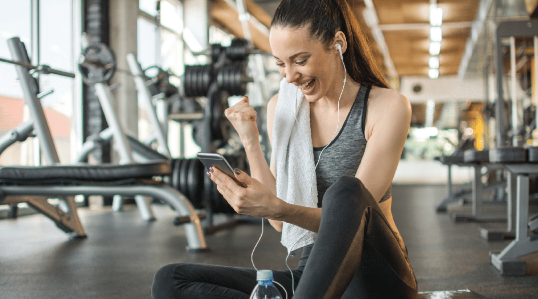 Woman Working Out at Gym on Phone