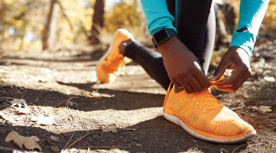 Person Tying Shoe Fitness Watch