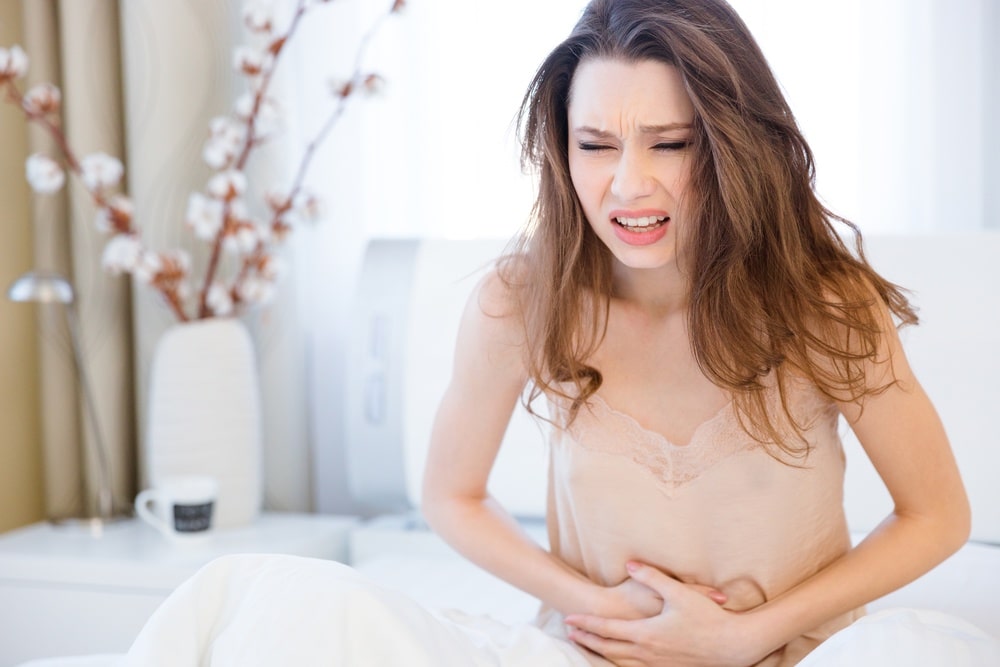 Woman experiencing stomach pain