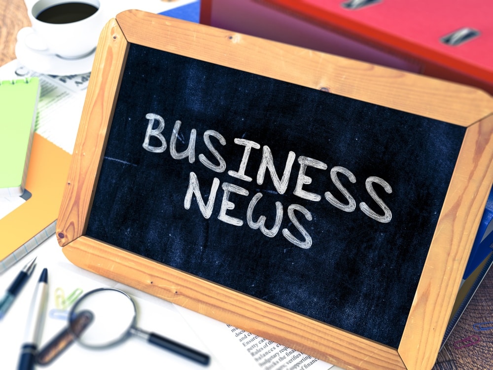 Business News Concept Hand Drawn on Chalkboard on Working Table Background. Blurred Background. Toned Image..jpeg