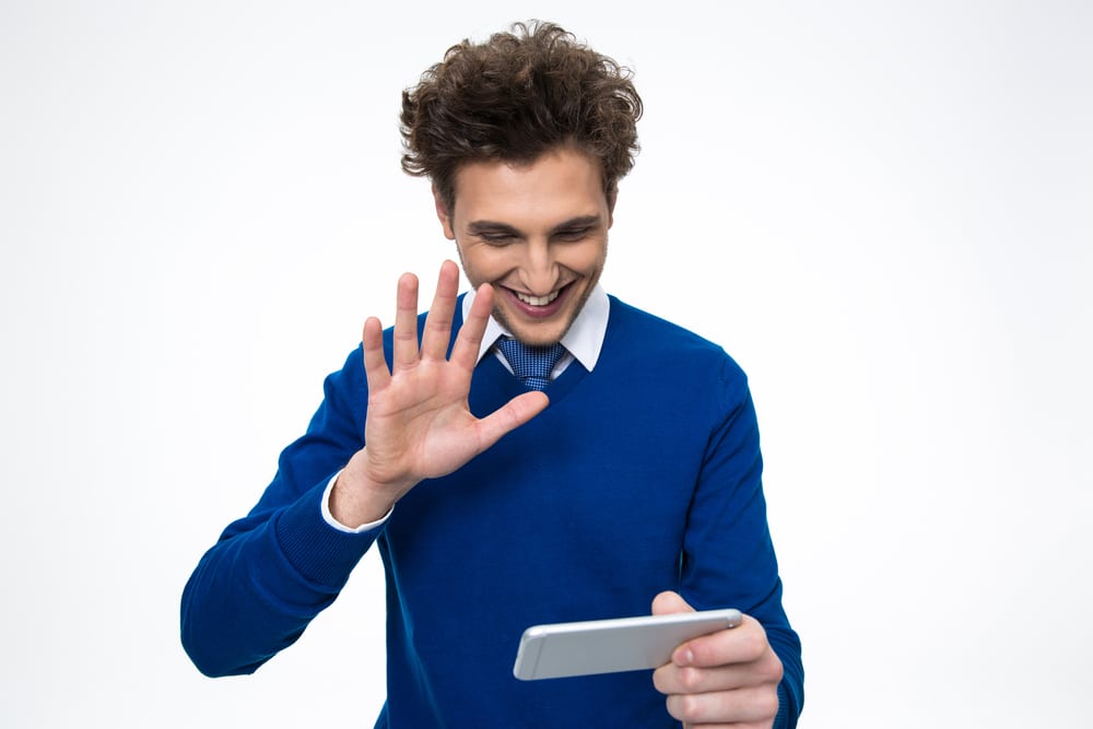 Happy business man using smartphone over white background-1