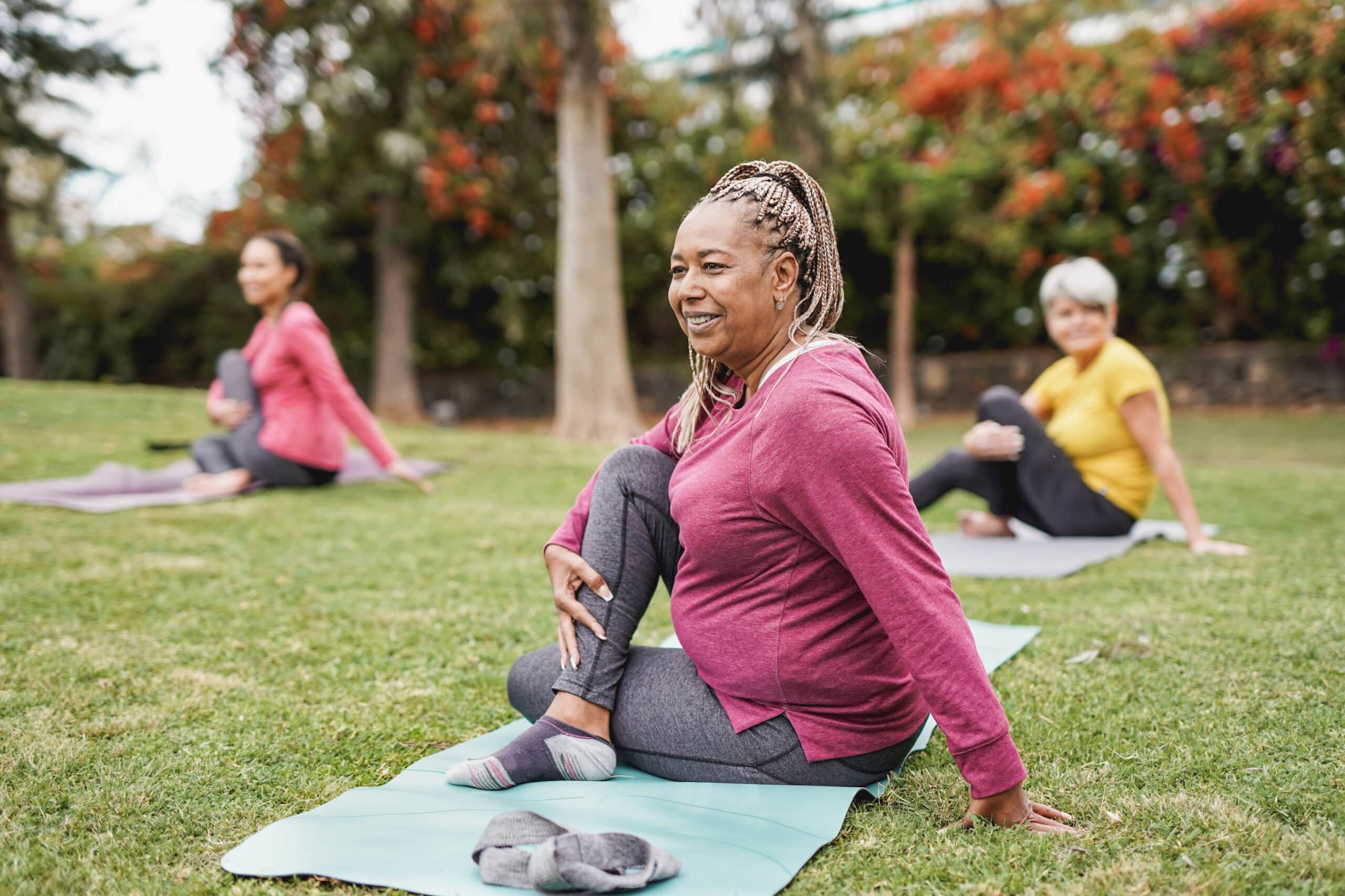 Women doing yoga outside