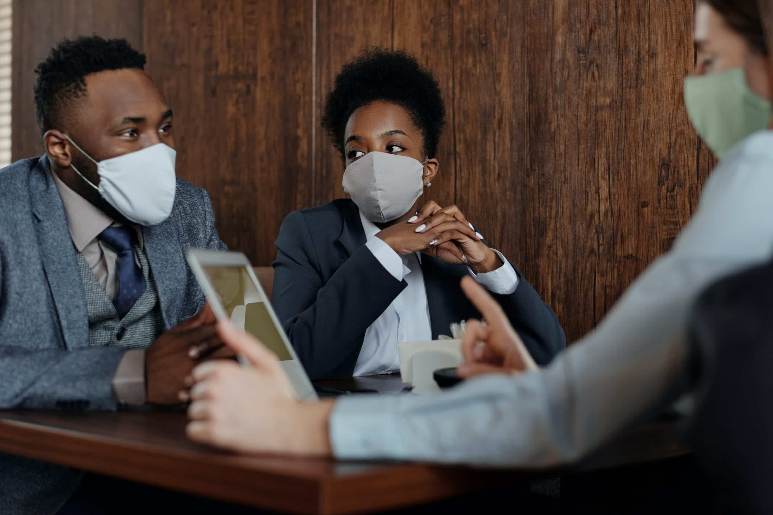 3 people wearing masks