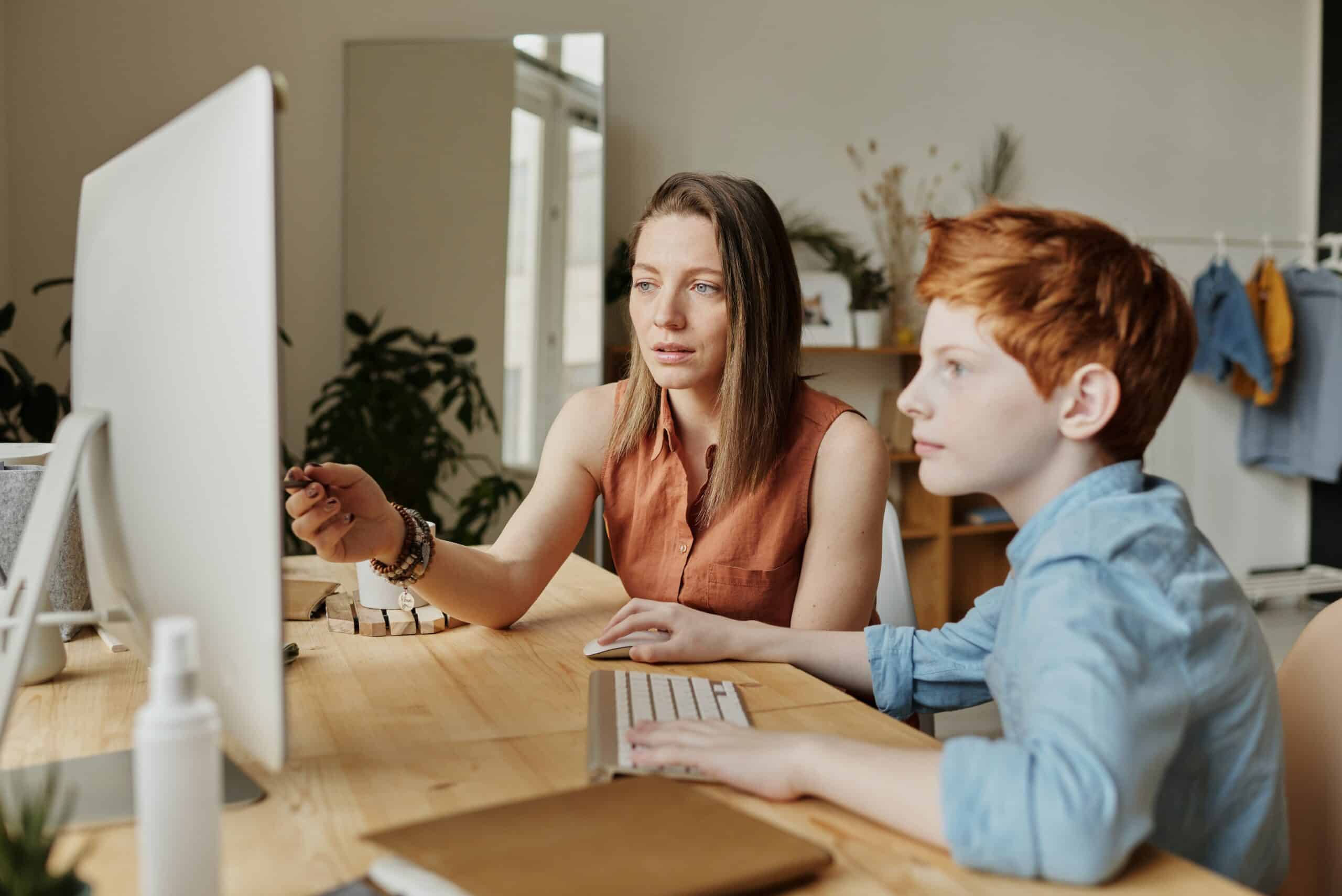 mom helping son with online school