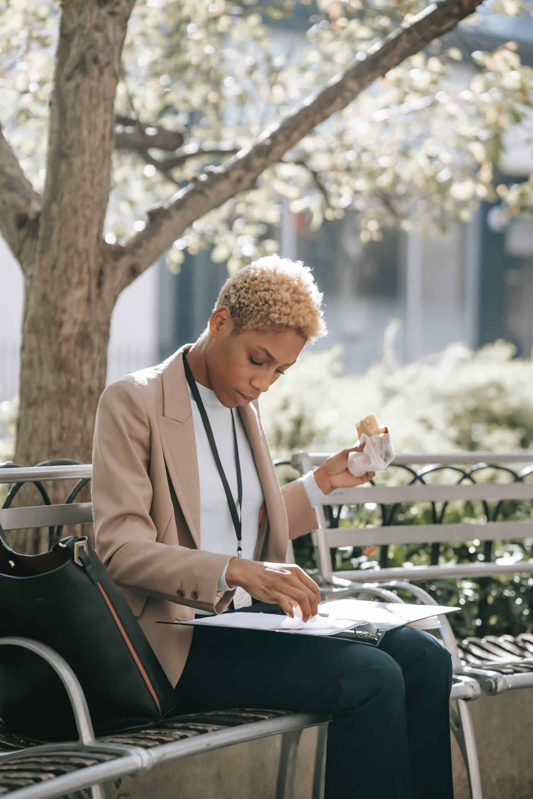 Woman eating lunch on bench