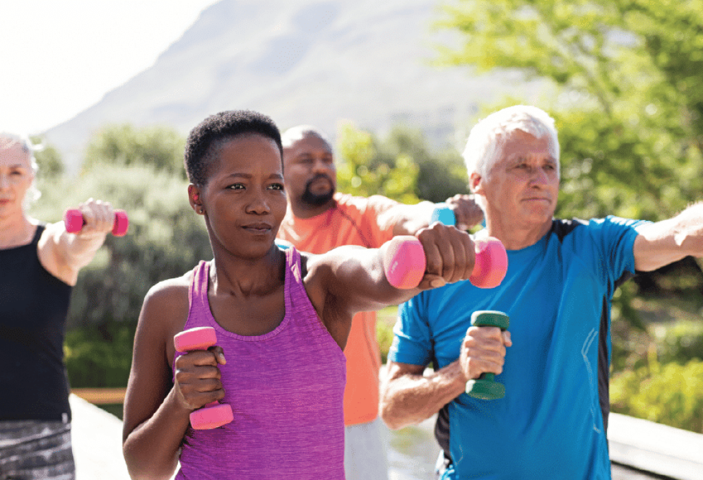 Group of 4 Lifting Weights Outdoors