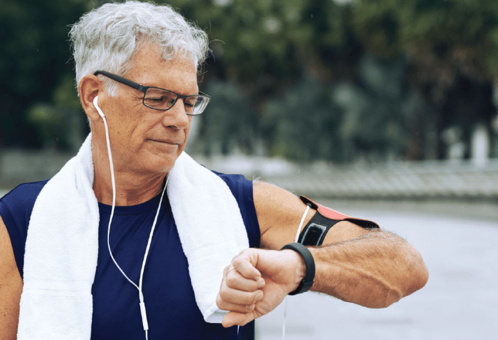Man Checking Wearable Device Running