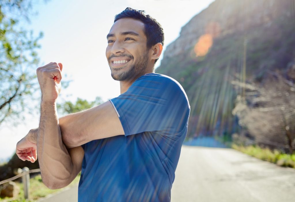 Smiling man working out