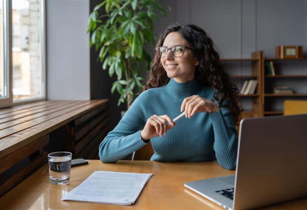 Smiling woman working at desk